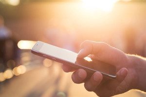 Man using his Mobile Phone outdoor